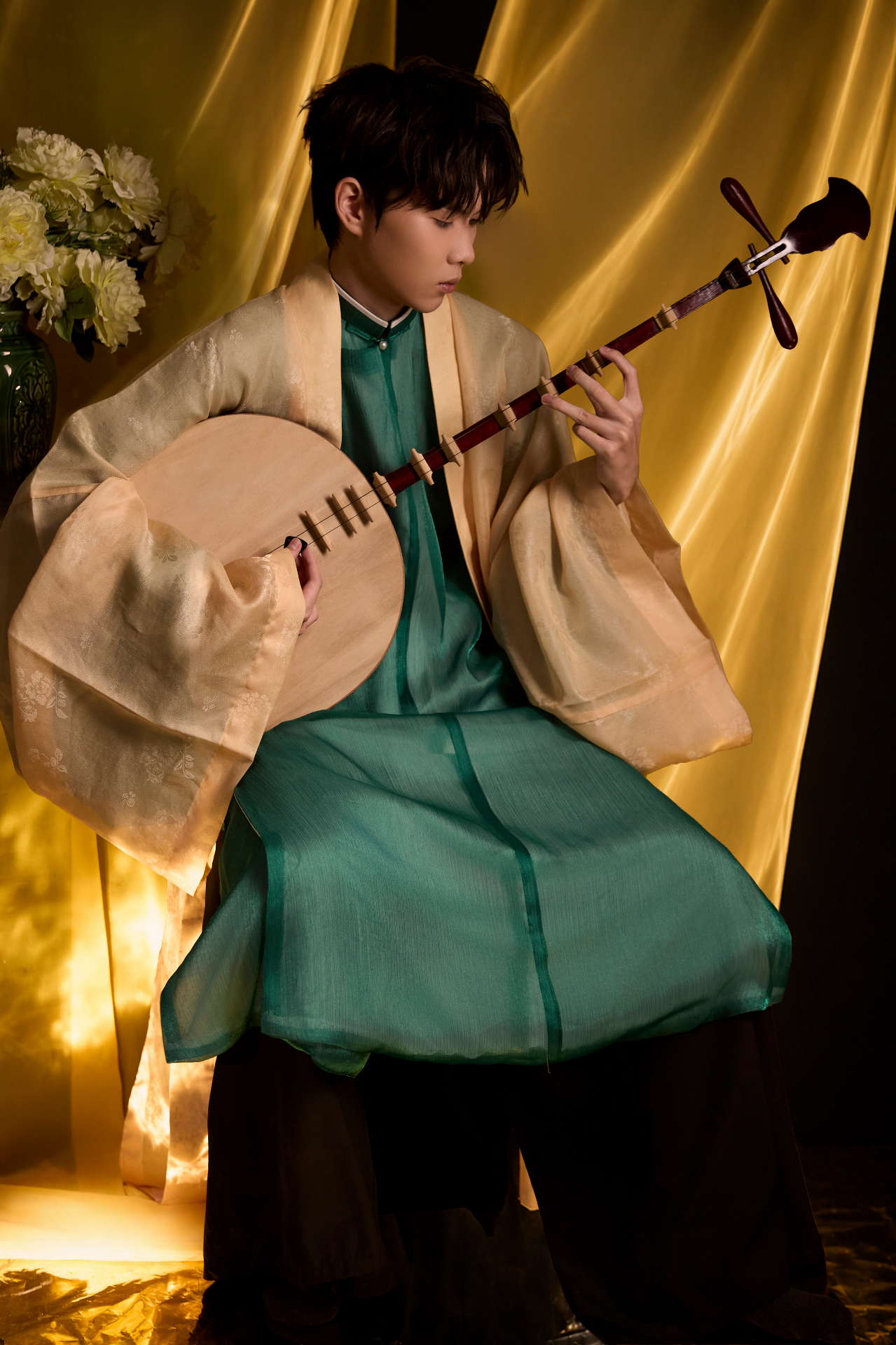 Lemon — Vietnamese composer, holding a moon lute in jade silk robes